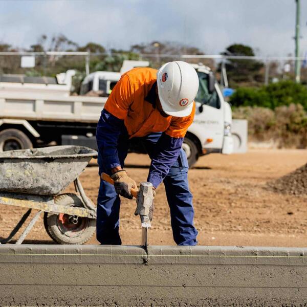 Man in hard hat conducting commercial civil construction services in Melbourne